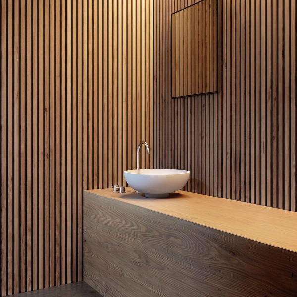 Ein Badezimmer mit Holzlatten für eine warme und einladende Atmosphäre. | casaceramica